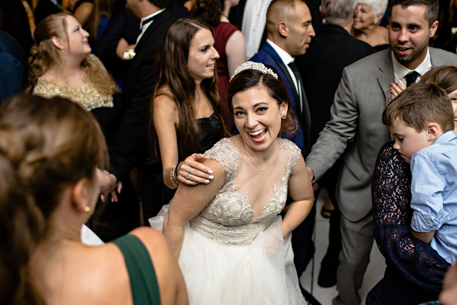 A bride dancing with her wedding guests at Vie.